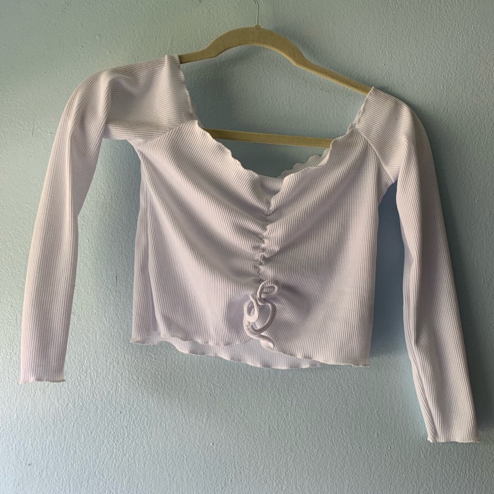 Off the shoulder white long sleeve.